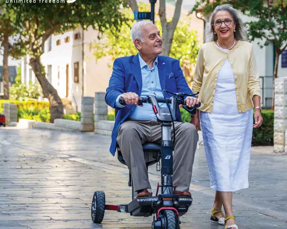 Movinglife mobility scooter beside a woman on an outdoor walk