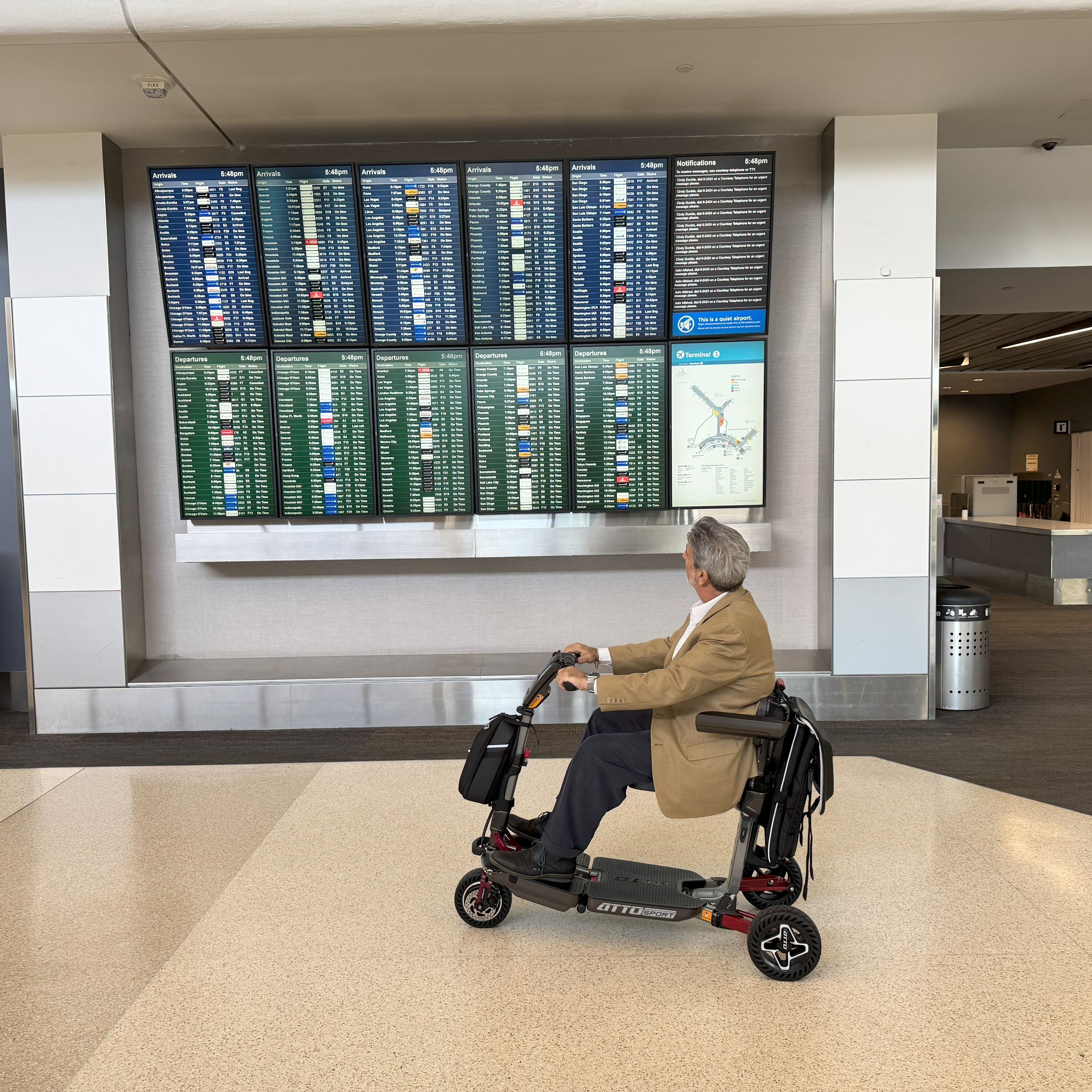 Customer travelling with a mobility scooter in the airport