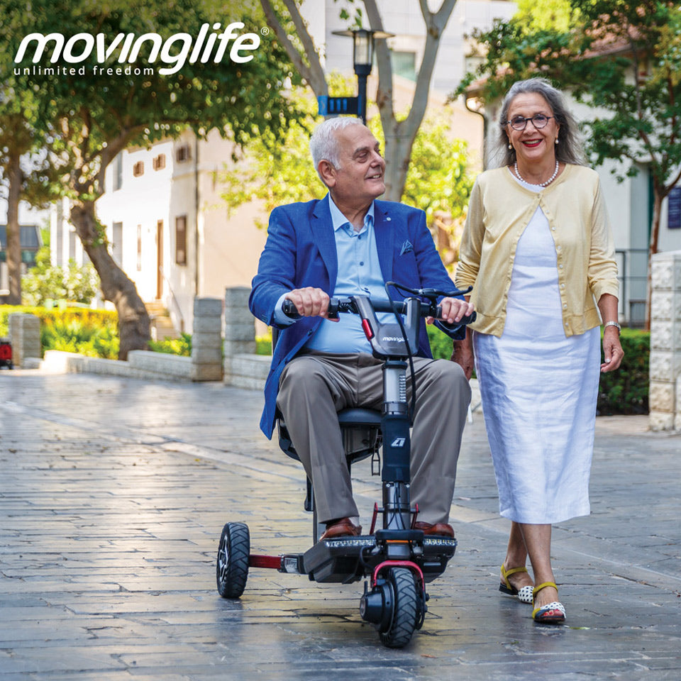 Couple walking with movinglife foldable mobility scooter